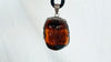 Large Amber and Sterling. Pendant on a Leather Cord
