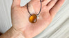 Large Amber Pendant on a Leather Cord. 0605
