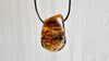 Large Amber Pendant on a Leather Cord. 1173