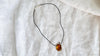 Large Amber Pendant on a Leather Cord. 0605