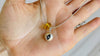 Evil Eye Pendant. Sterling Silver and Amber.