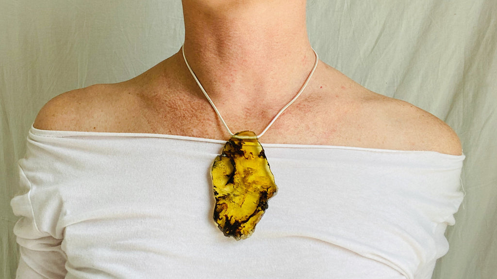 Large Amber Pendant on a Silver Cord. Snake Chain.