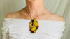 Large Amber Pendant on a Silver Cord. Snake Chain.