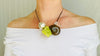 Serpentine, Ammonite, Crystal and Silver Pendant Necklace.